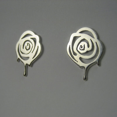 Painting the roses red Alice in wonderland exclusive collection earrings earstuds sterling silver paint dripping roses hand pierced unique piece 15 millimeters € 85,- Daphne Meesters Jewellery Designer Goldsmith The Hague Netherlands