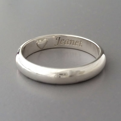 Memorial ring men's jewellery half round sterling silver plain band engraving heart ash chamber shiny finish mourning ashes cremation urn jewellery Daphne Meesters Jewellery Designer Goldsmith The Hague Netherlands