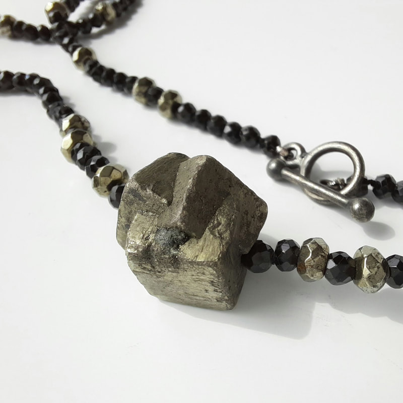 You rock short necklace rough square cluster pyrite faceted black onyx beads and sterling silver toggle clasp simple elegant 45.5 centimeters € 195,- Daphne Meesters Jewellery Designer Goldsmith The Hague Netherlands