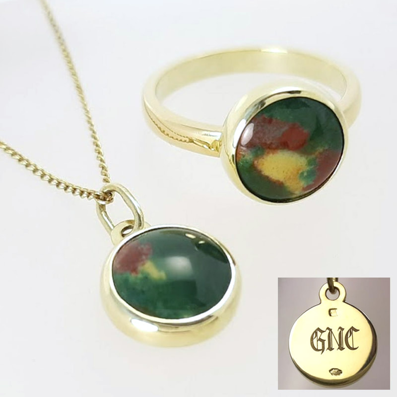GNC pendant and ring in yellow gold with a bloodstone in dark green dark red and yellowish white high gloss finish  Daphne Meesters Jewellery  Designer Goldsmith The Hague Netherlands