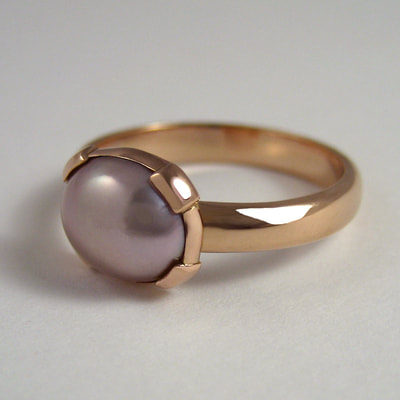 Ring half round wire 14K red gold and oval pink pearl shiny finish Daphne Meesters Jewellery Designer Goldsmith The Hague Netherlands
