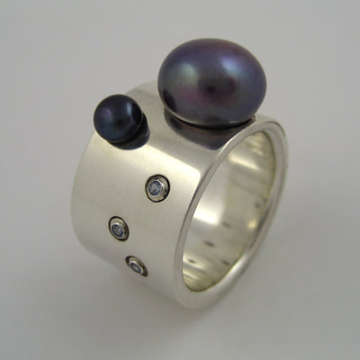 Enchanted ring sterling silver wide band pearls and topaz Daphne Meesters Jewellery Designer Goldsmith The Hague Netherlands