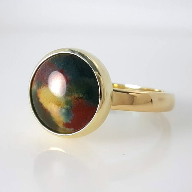 GNC ring in yellow gold with a bloodstone in dark green dark red and yellowish white high gloss finish  Daphne Meesters Jewellery  Designer Goldsmith The Hague Netherlands