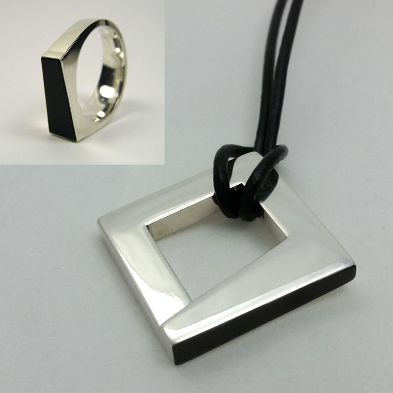 Trapezoid wedding ring and unisex wedding pendant sterling silver Trapezoid trouwring met re-cut black onyx  from grandpa's ring square trapezoidal black surface on black leather cord shiny polish Daphne Meesters Jewellery  Designer  Goldsmith The Hague Netherlands