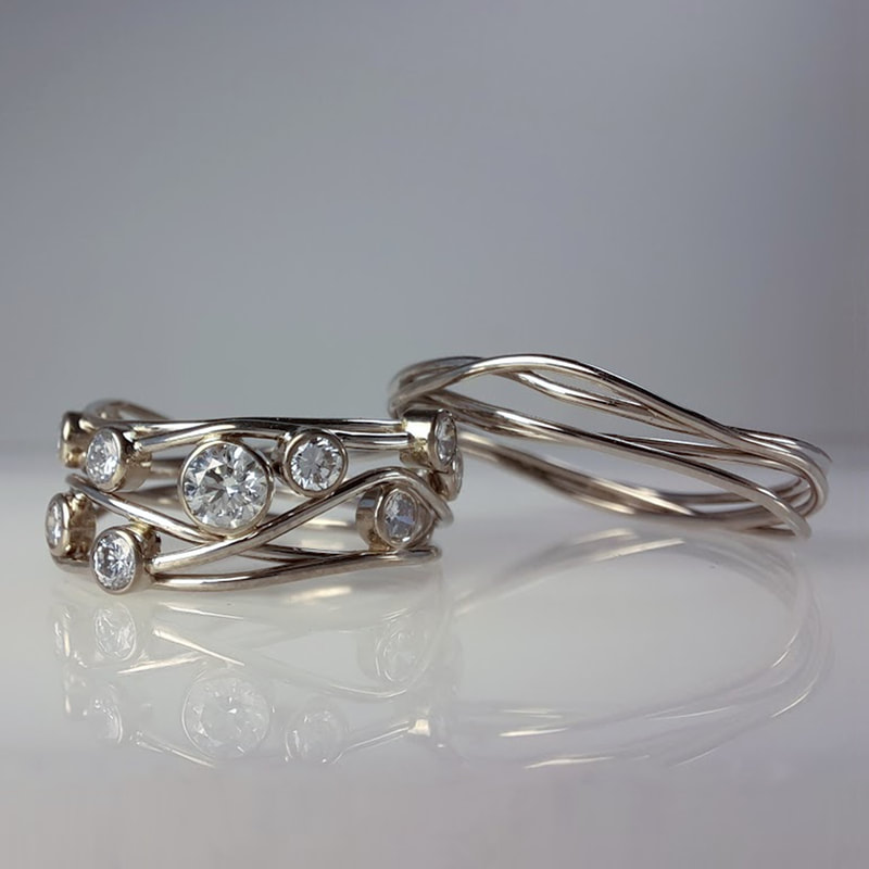 Birds nest wedding rings from 14 carat white gold wire with precious inherited diamonds in between  Daphne Meesters Jewellery Designer Goldsmith The Hague Netherlands